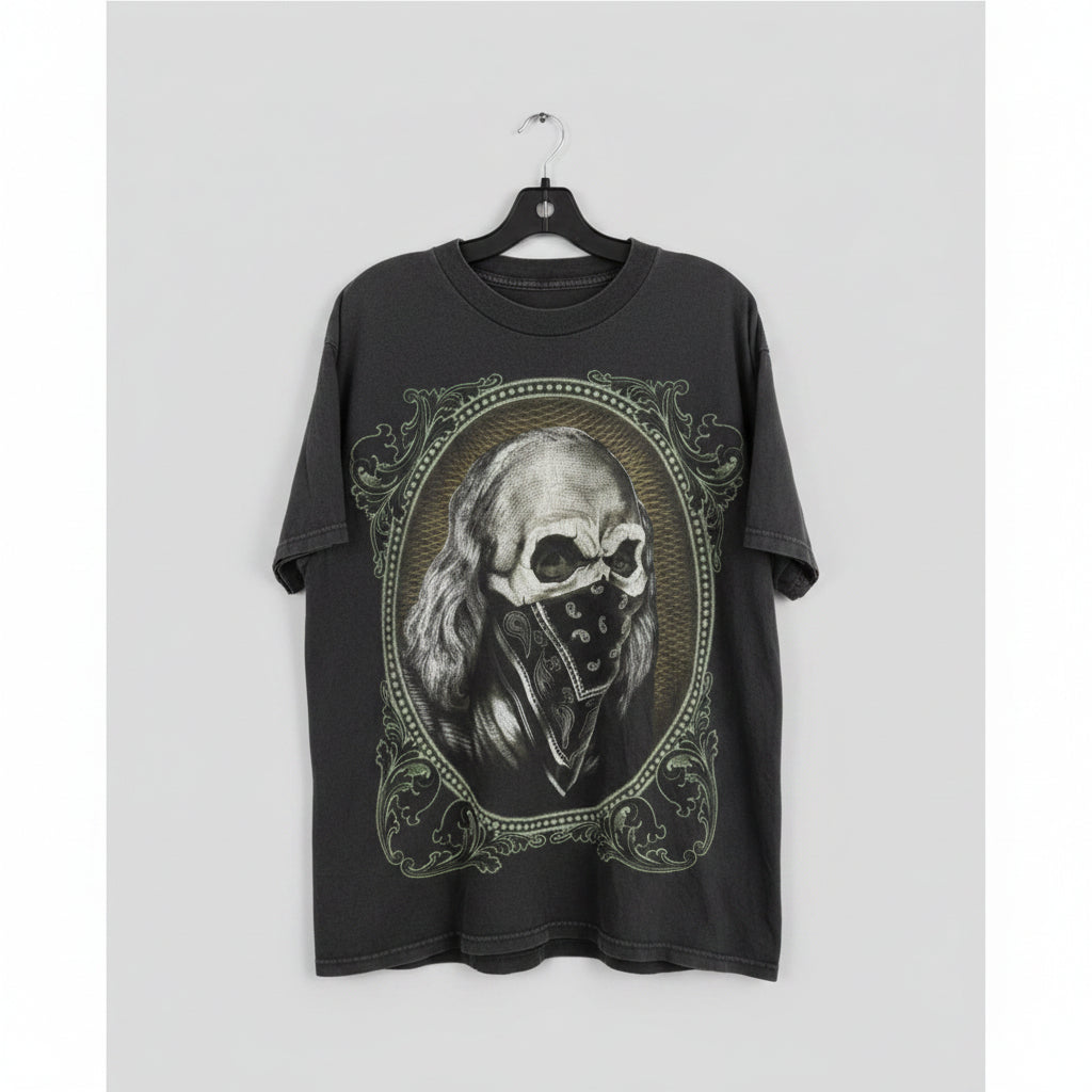 Gray t-shirt with skull design hanging on a wooden panel wall