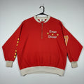 Red sweatshirt with 'Camp Champ' text and design on a gray background