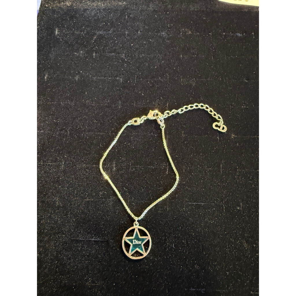 Christian Dior Vintage Gold Tone Teal Enamel Star Charm Bracelet CD Logo Pendant